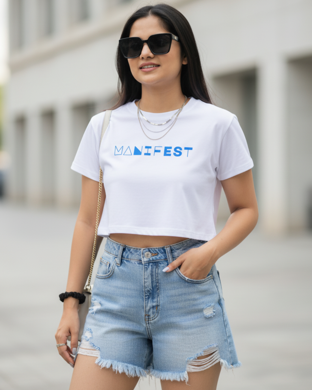 Baby White Tee – Bold “MANIFEST” Graphic Edition