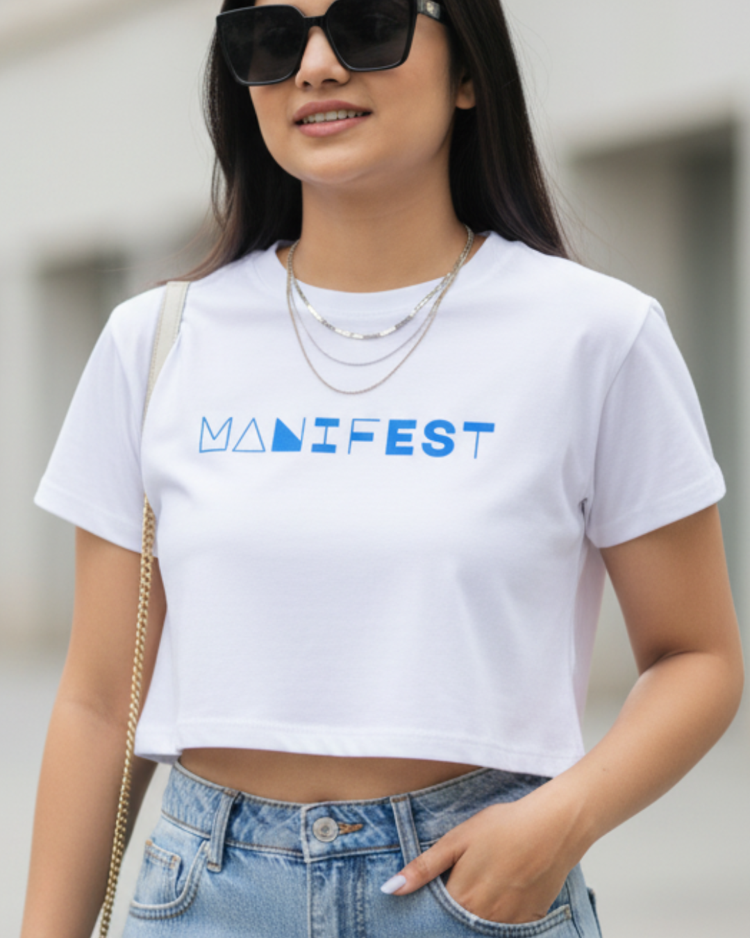 Baby White Tee – Bold “MANIFEST” Graphic Edition